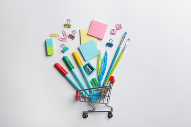 Photo of Flat lay composition with school stationery on white background. Back to school