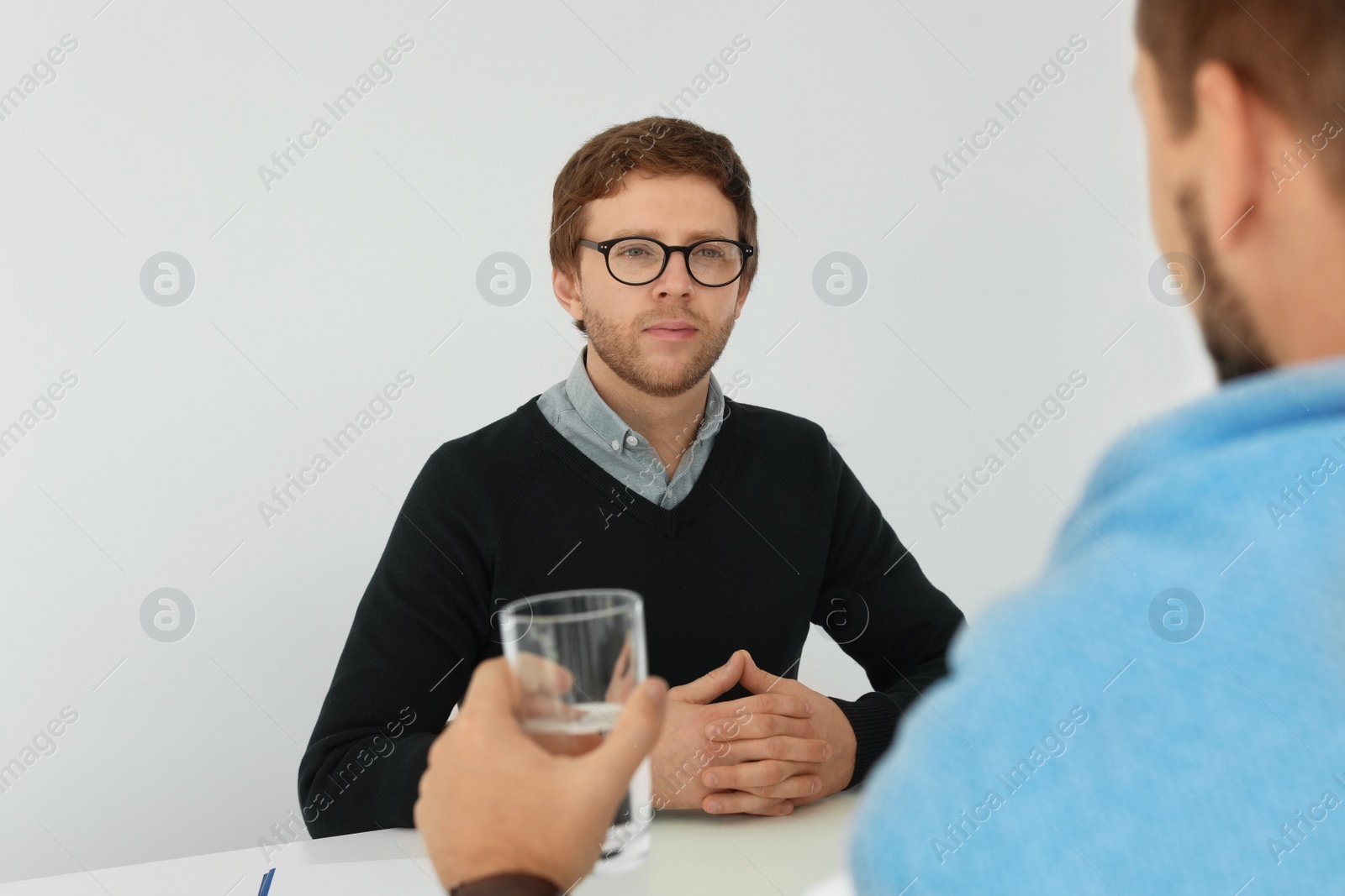 Photo of Human resources manager conducting job interview with applicant in office