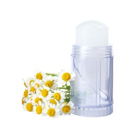 Photo of Natural crystal alum deodorant with chamomile flowers on white background
