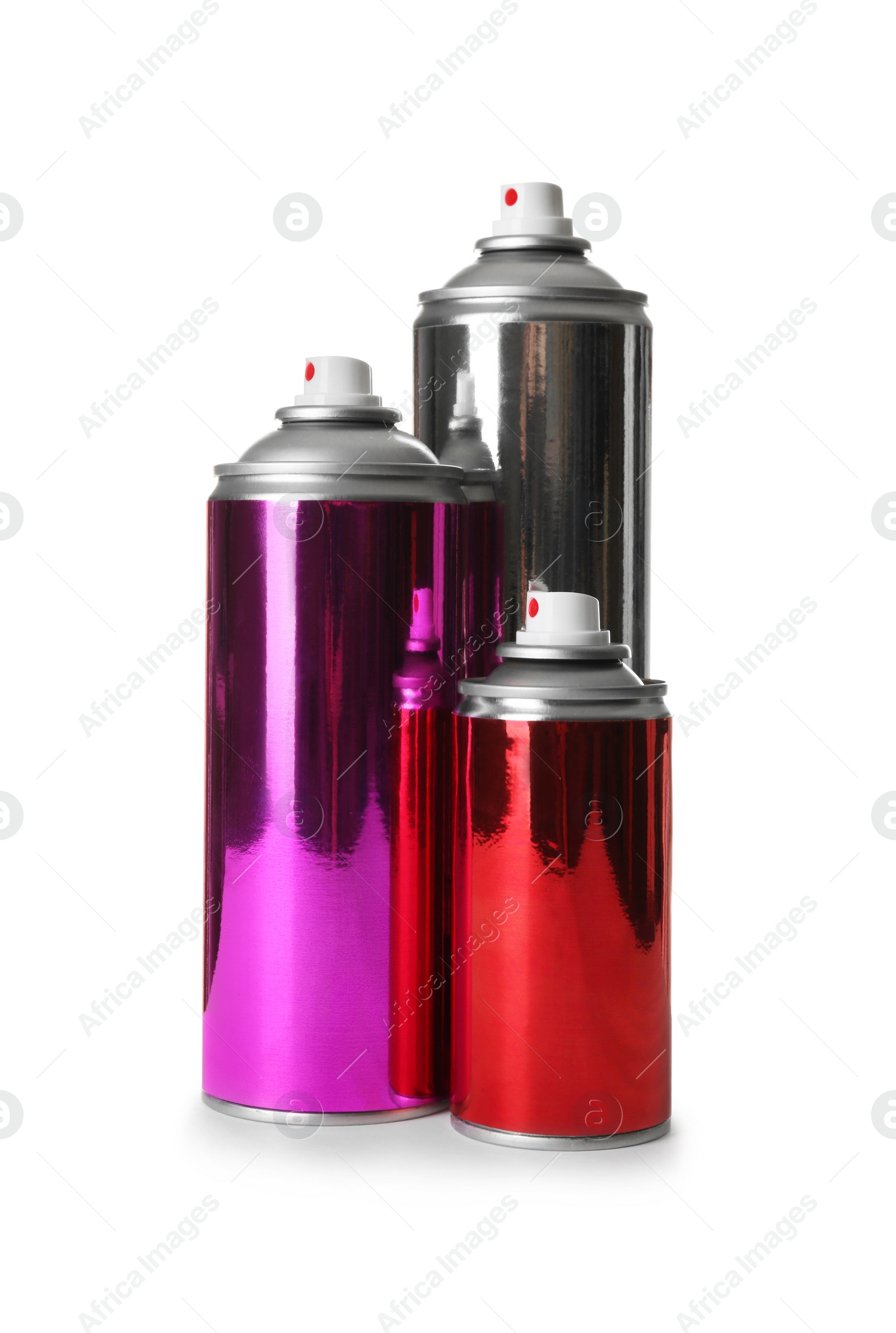 Photo of Different cans of spray paints on white background