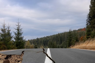 Image of Large cracks on asphalt road after earthquake