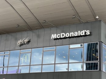 Photo of WARSAW, POLAND - JULY 17, 2022: Shopping mall with McCafe and McDonald's logos outdoors