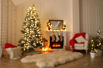 Photo of Fireplace in beautiful living room decorated for Christmas, blurred view