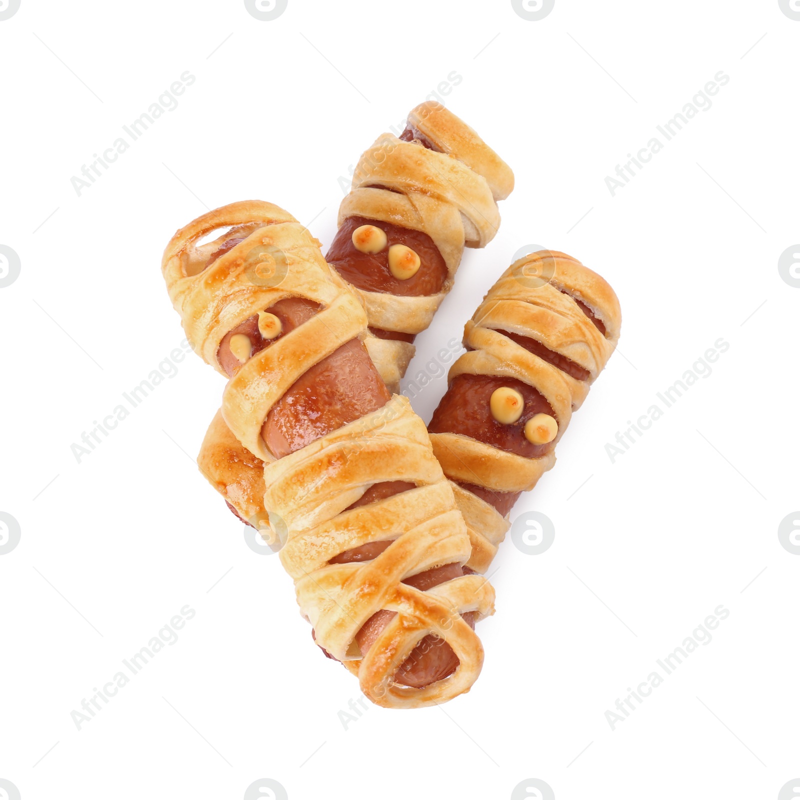 Photo of Cute sausage mummies isolated on white, top view. Halloween party food