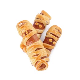 Photo of Cute sausage mummies isolated on white, top view. Halloween party food