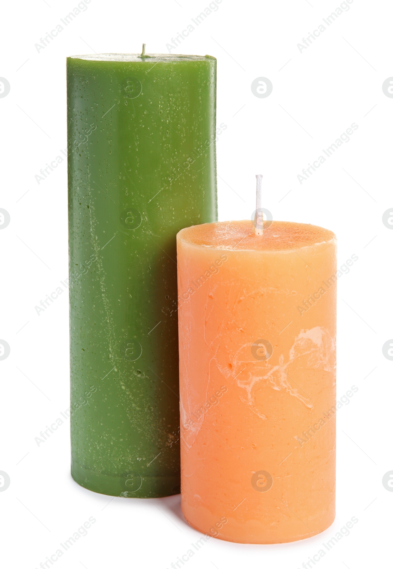 Photo of Two decorative wax candles on white background