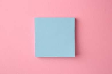 Photo of Blank paper note on pink background, top view