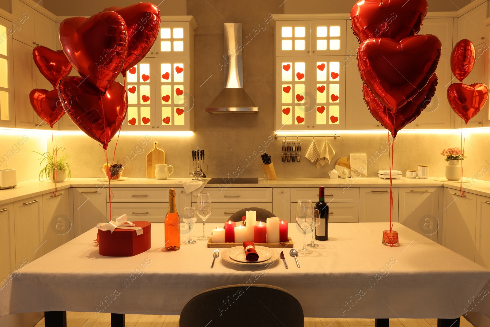 Photo of Romantic atmosphere. Cosy kitchen with set table decorated for Valentine day