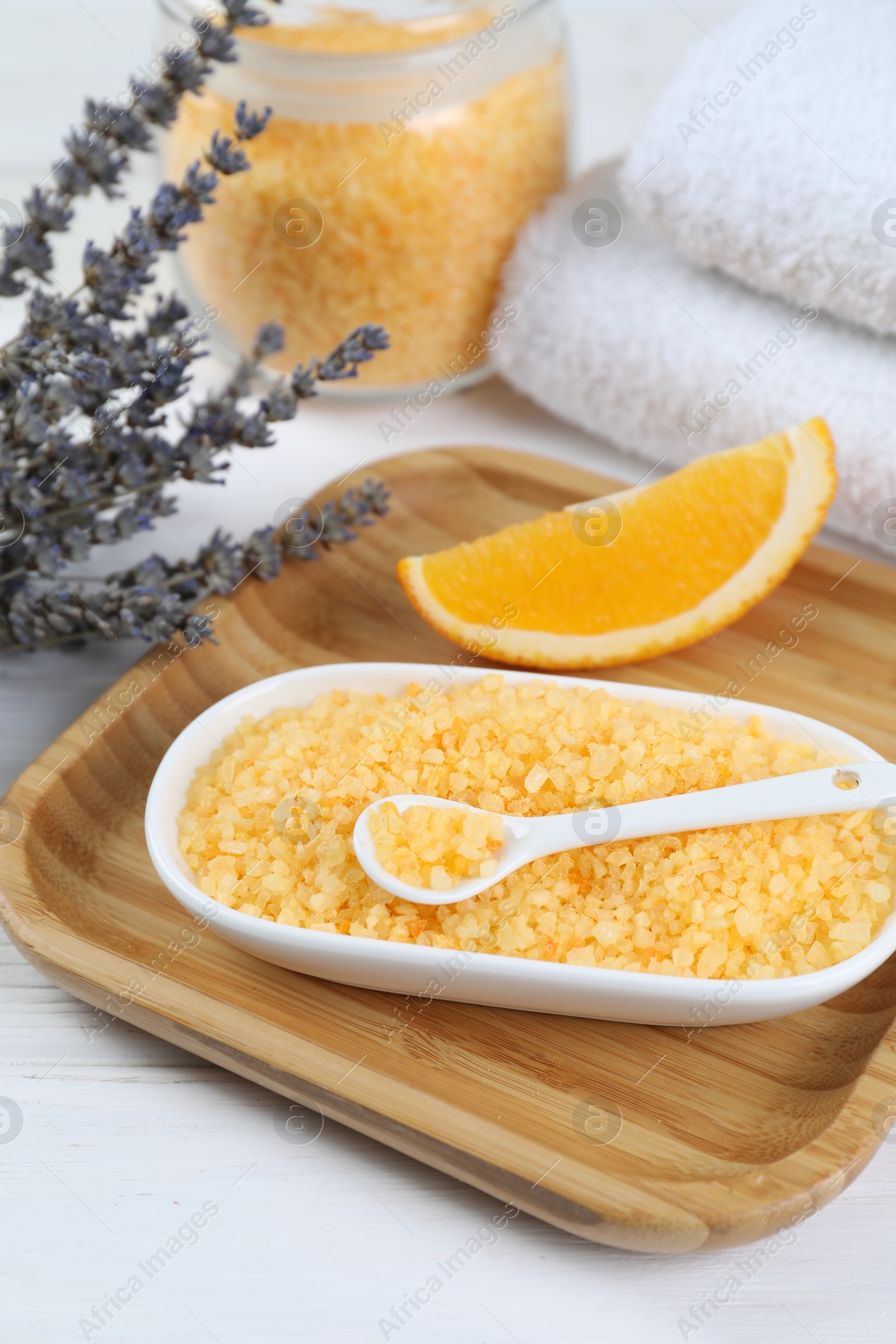 Photo of Sea salt, lavender, orange and towels on white wooden table