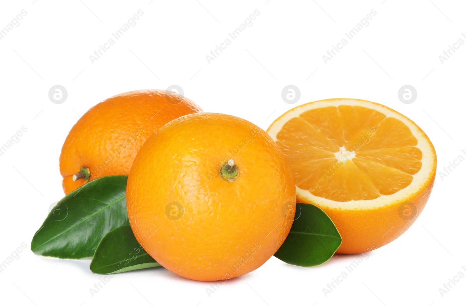 Photo of Fresh ripe oranges with leaves isolated on white