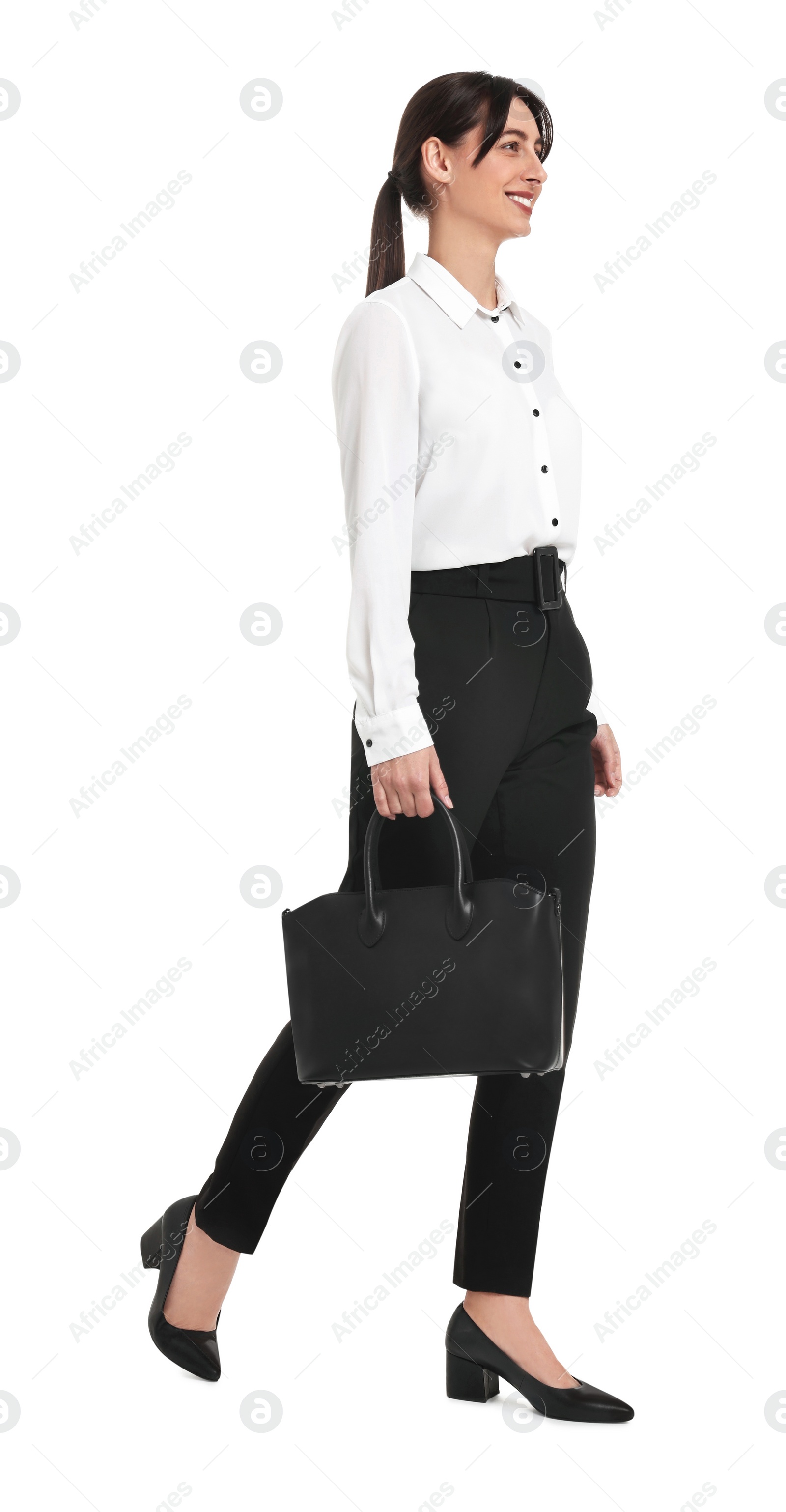 Photo of Happy businesswoman with bag walking on white background