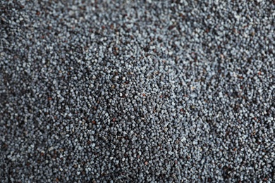Photo of Whole poppy seeds as background, top view