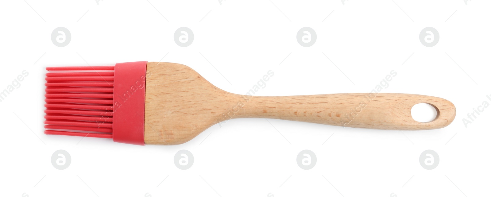 Photo of Red silicone brush with wooden handle isolated on white, top view. Cooking utensil