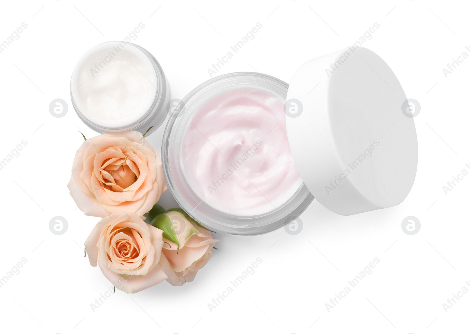 Photo of Body cream and cosmetic product with rose on white background, top view