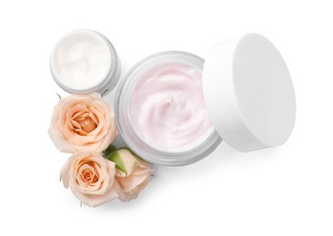 Body cream and cosmetic product with rose on white background, top view