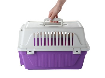 Woman holding violet pet carrier on white background, closeup