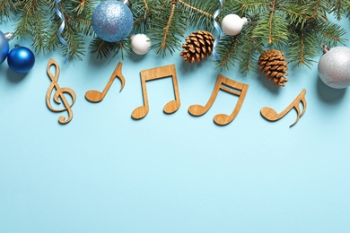 Flat lay composition with decorations and notes on color background. Christmas music concept