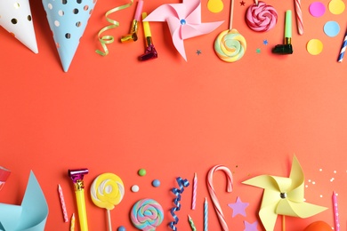 Photo of Flat lay composition with different birthday party items on coral background, space for text