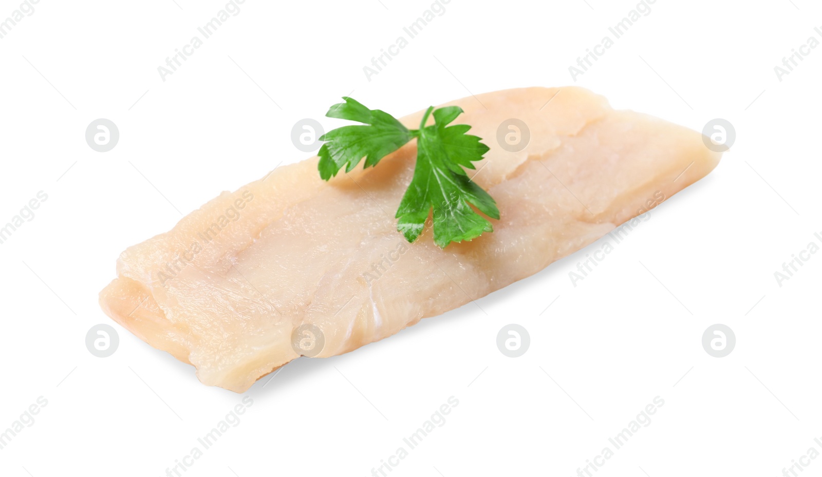 Photo of Piece of raw cod fish and parsley isolated on white