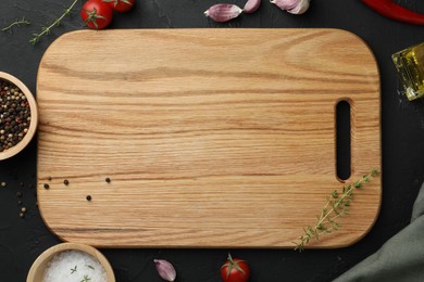 Photo of Cutting board, fresh tomatoes and different spices on grey textured table, flat lay