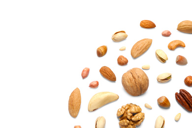 Different delicious nuts on white background, flat lay. Space for text