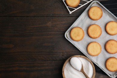 Photo of Tasty sweet sugar cookies on wooden table, flat lay. Space for text