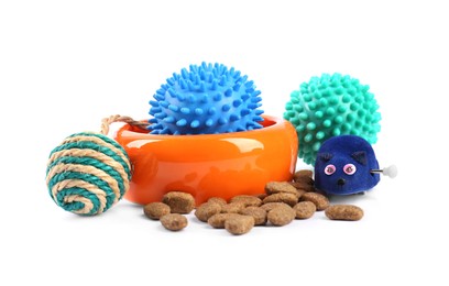 Pet dry food, bowl and toys on white background. Shop assortment