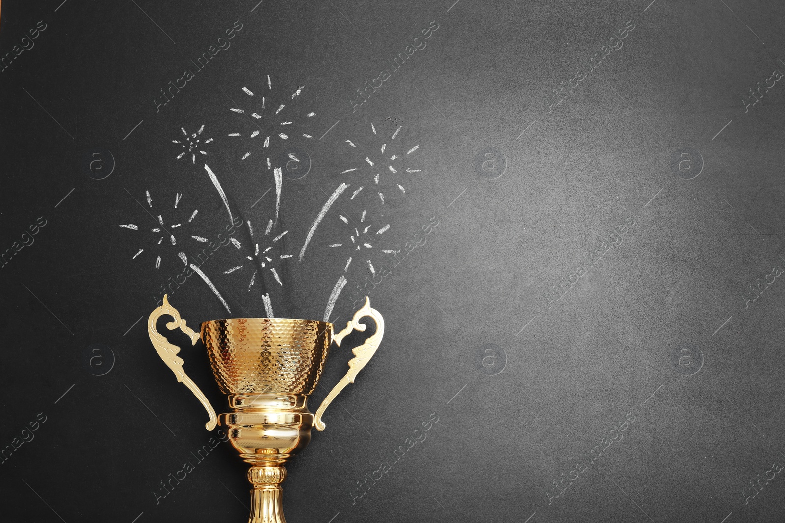 Photo of Trophy and chalk drawn salute on black background, space for text. Victory concept