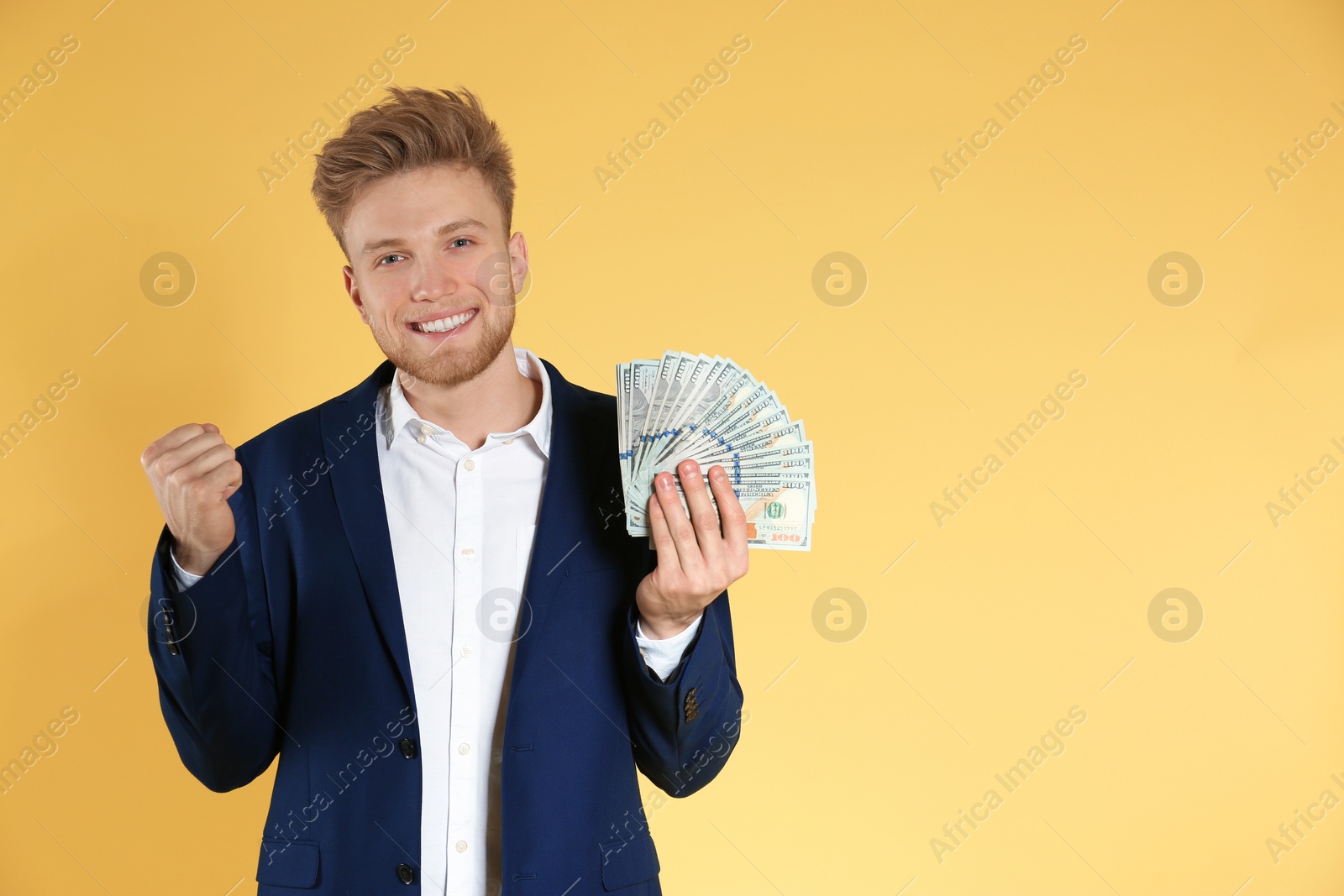 Photo of Businessman with money on color background. Space for text