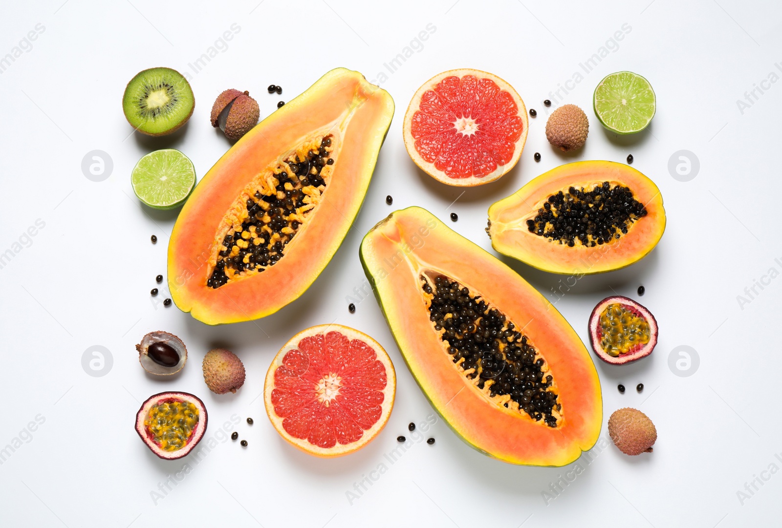 Photo of Fresh ripe papaya and other fruits on white background, top view