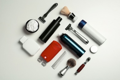 Flat lay composition with shaving accessories for men on white background