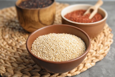 Photo of Composition with white quinoa in bowl on wicker mat