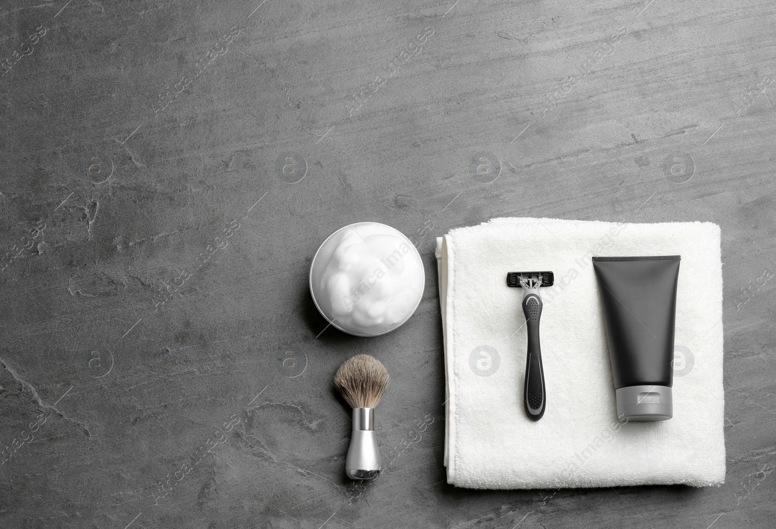 Photo of Flat lay composition with men's cosmetic products on grey background. Space for design