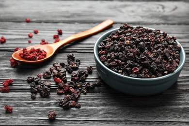 Dried black and red currant berries on wooden table