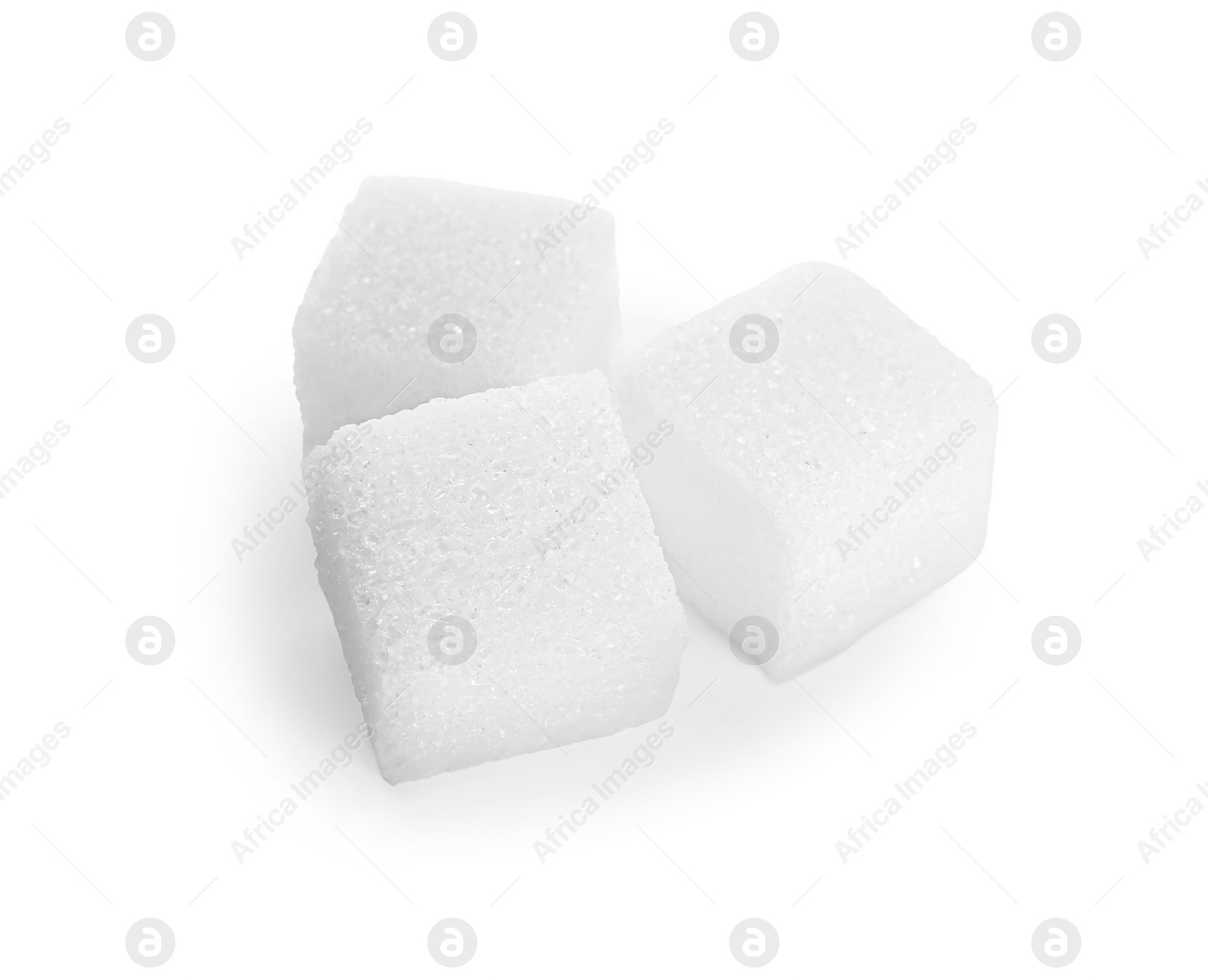 Photo of Three refined sugar cubes isolated on white