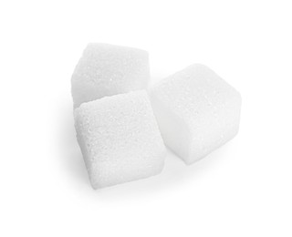 Photo of Three refined sugar cubes isolated on white