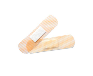 Photo of Medical sticking plasters isolated on white. First aid item