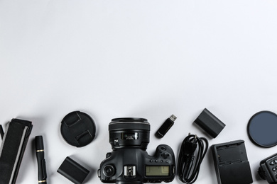 Photo of Flat lay composition with equipment for professional photographer on white background. Space for text