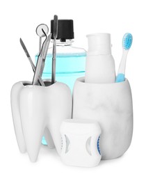 Photo of Many different teeth care products and dental tools on white background