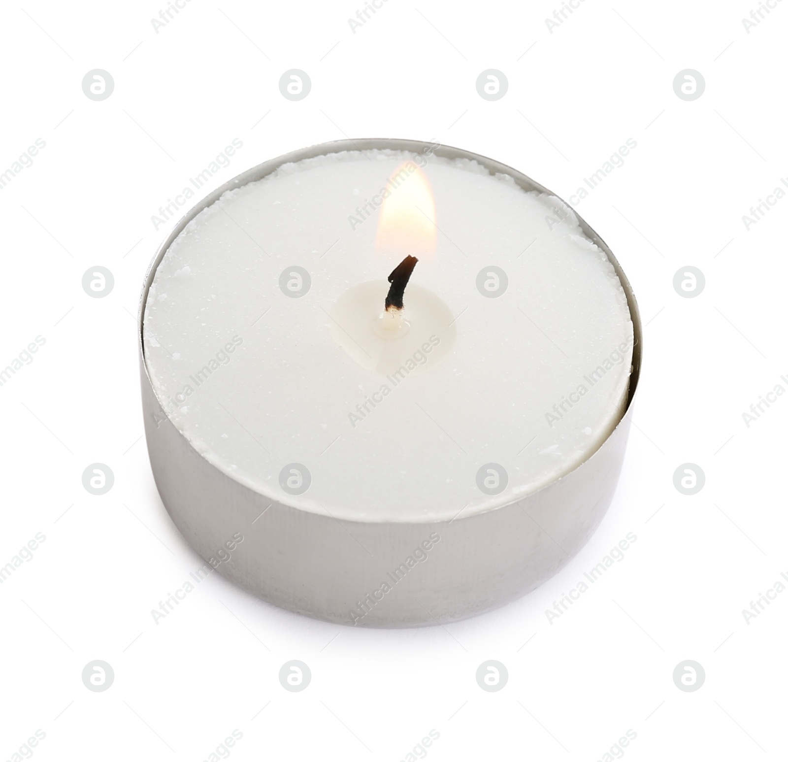 Photo of New wax candle burning on white background