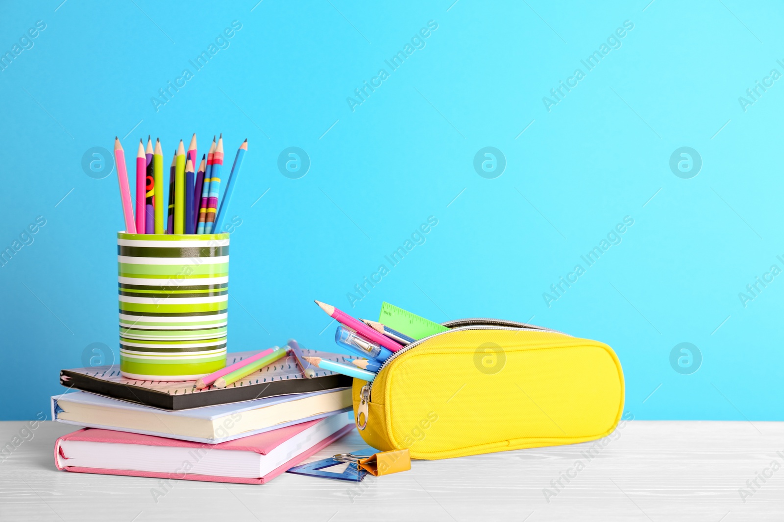 Photo of Different colorful stationery on table. Back to school