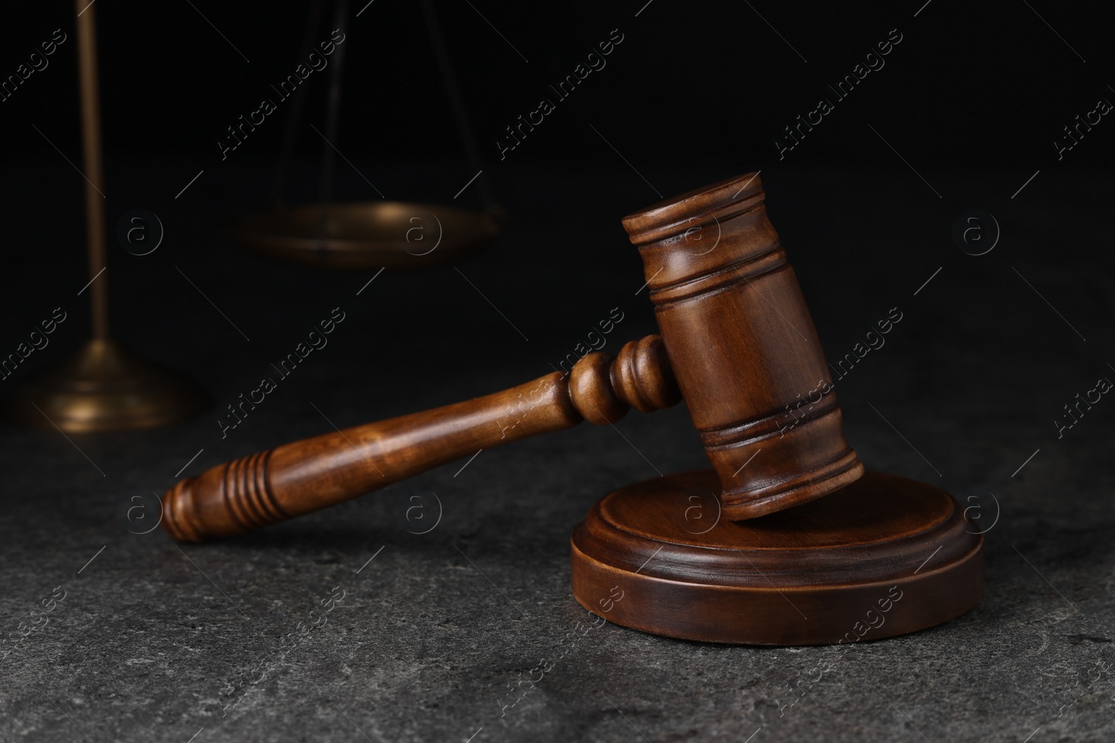 Photo of Law concept. Judge's gavel on grey textured table