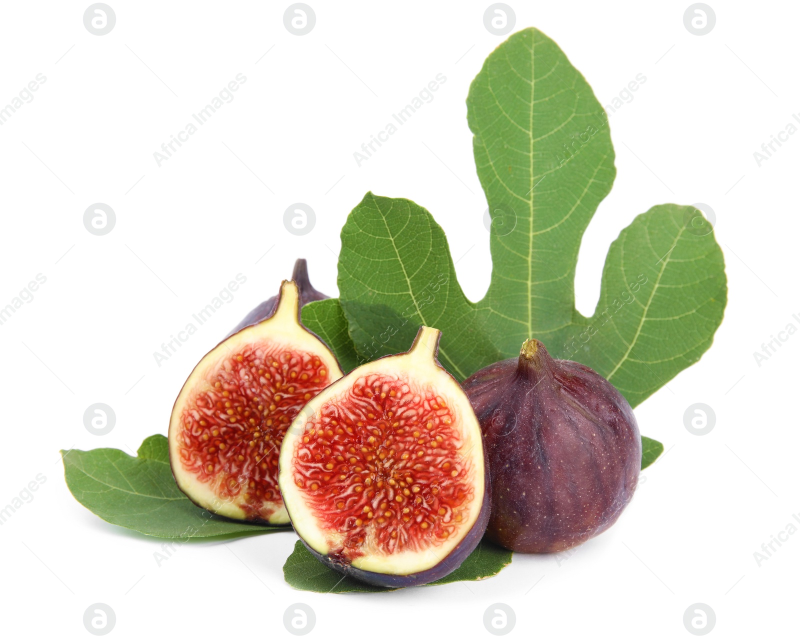 Photo of Fresh juicy purple figs and green leaves on white background