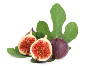 Photo of Fresh juicy purple figs and green leaves on white background