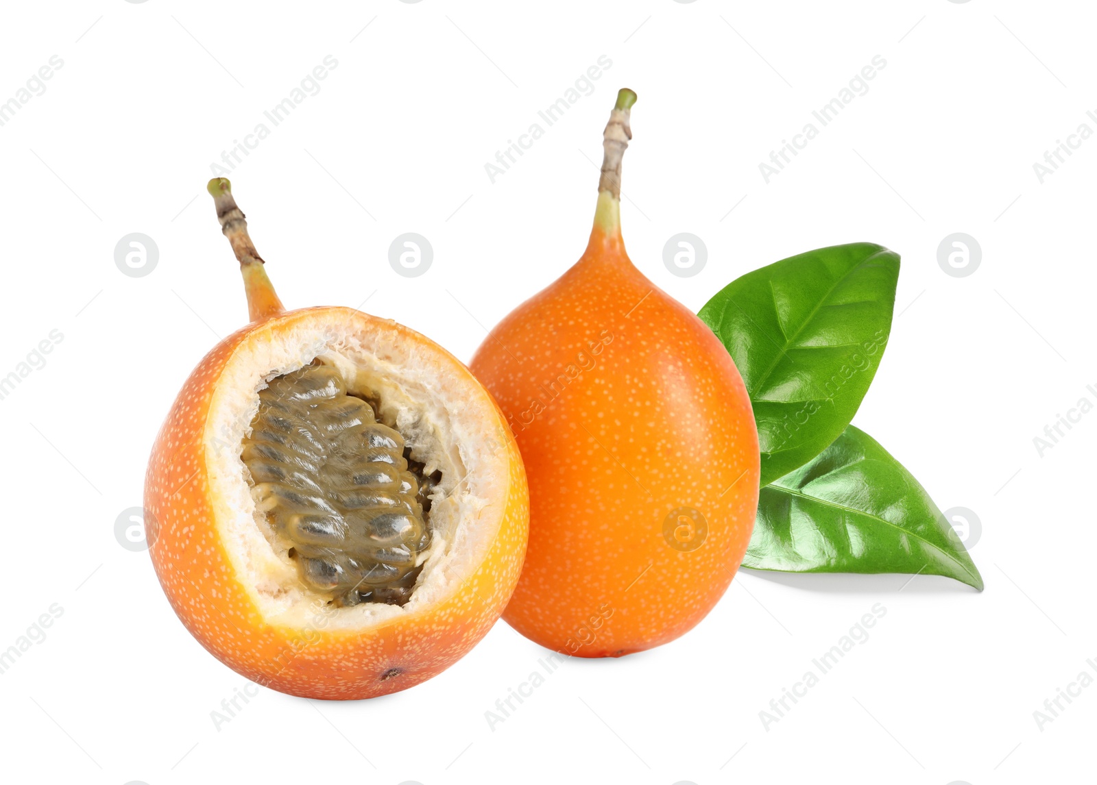 Image of Tasty ripe granadillas and green leaves on white background