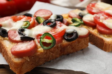 Tasty pizza toast on table, closeup view