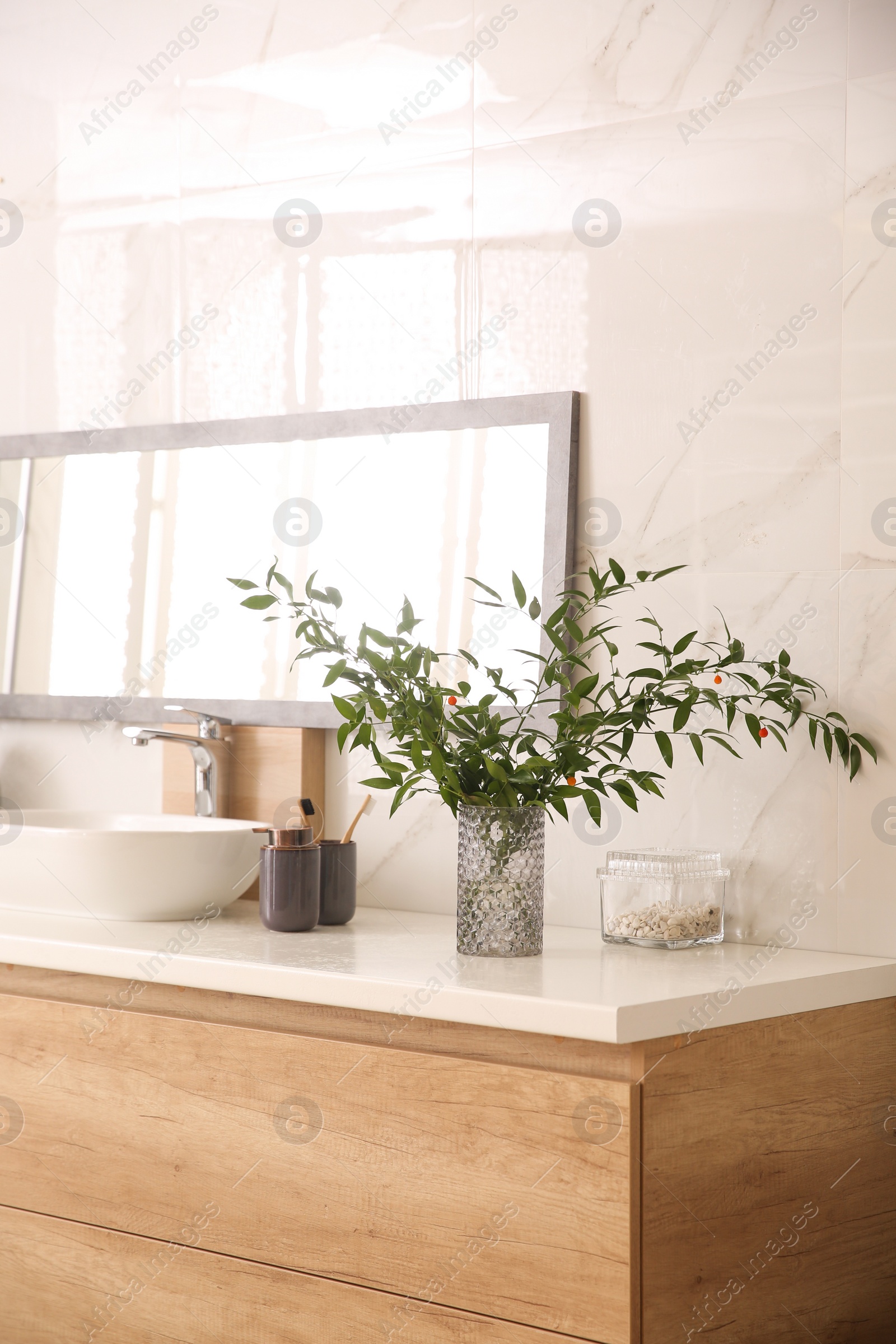 Photo of Modern bathroom interior with stylish mirror and vessel sink