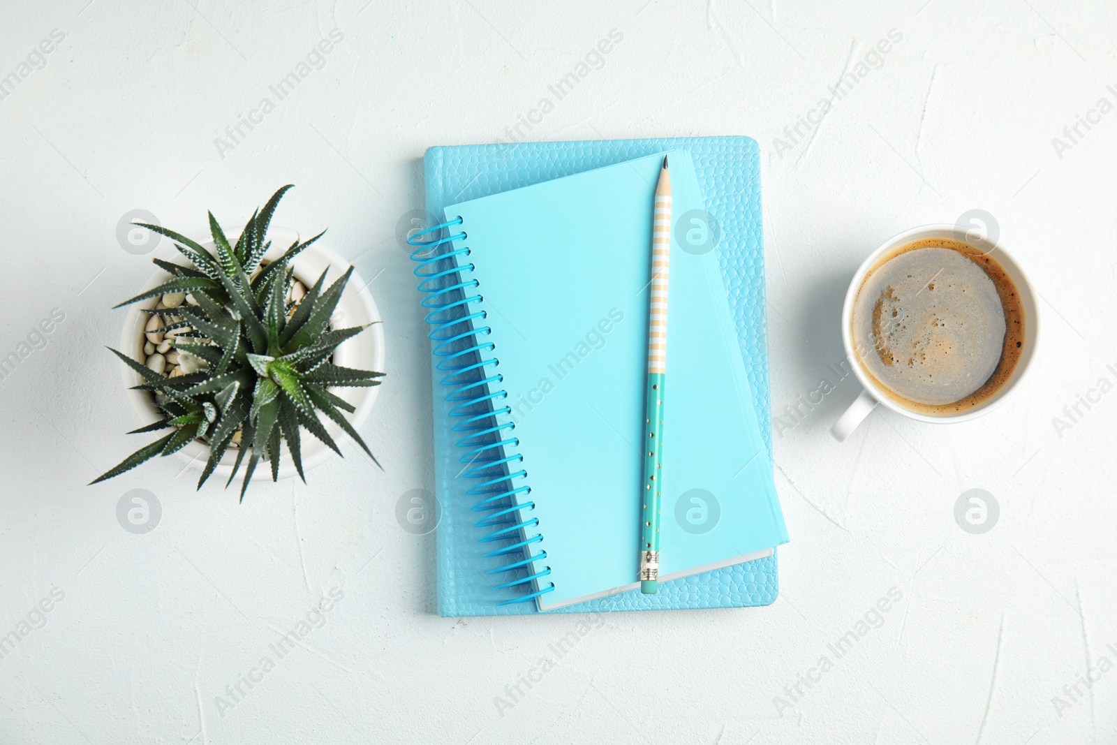 Photo of Flat lay composition with notebooks and coffee on white background