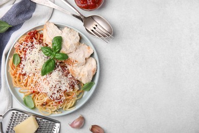 Photo of Delicious pasta with tomato sauce, chicken and parmesan cheese on white table, flat lay. Space for text