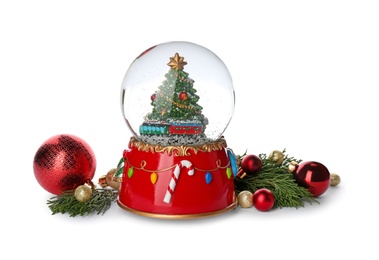 Beautiful snow globe, Christmas balls and coniferous twigs on white background